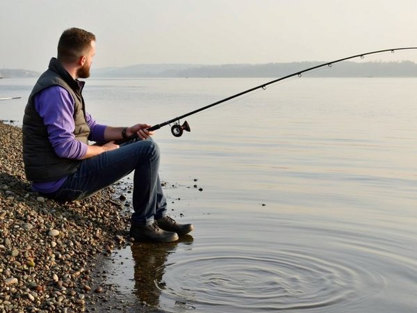 What are the impacts of UK recreational fishing on local ecosystems, and how can they be reduced?